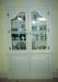 Redundant window.     Now a French display with fielded bottom doors with snake hinges